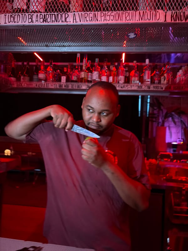 Bartender prepares drinks at Dubai establishment