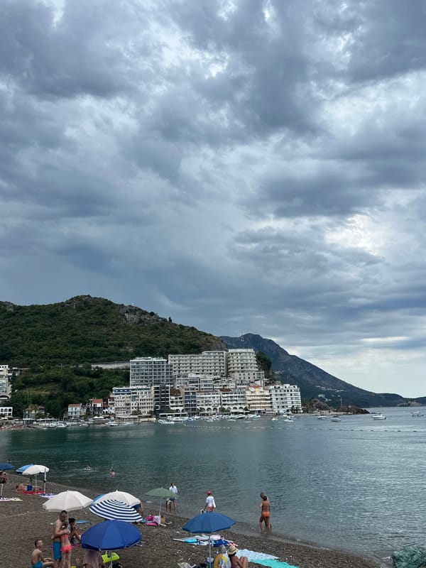 Quiet cloudy morning on the pebble beach in Rafailovići