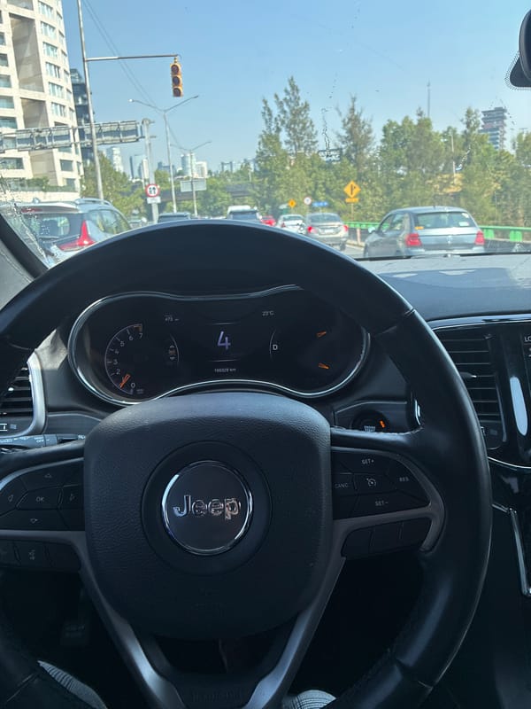Jeep traveling slowly through Mexico City streets