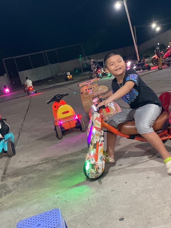 Night market energy in Mũi Né — food, rides, and street life