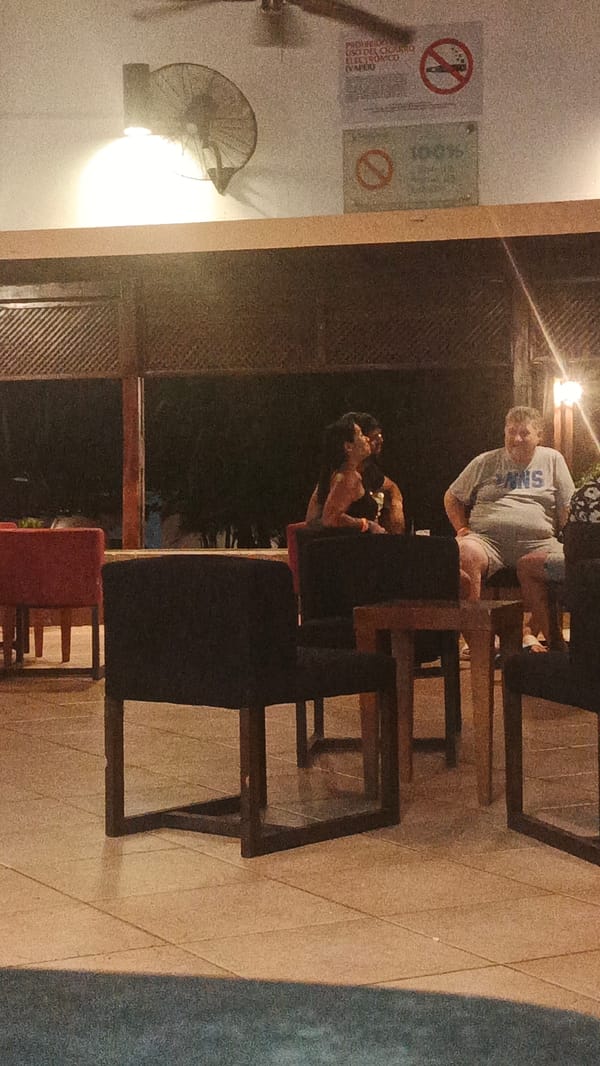Late-night social gathering captured at Playa El Agua venue