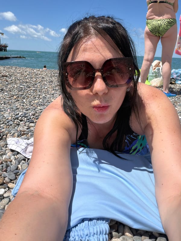 Relaxing on Sochi's Black Sea pebble beach on a sunny morning