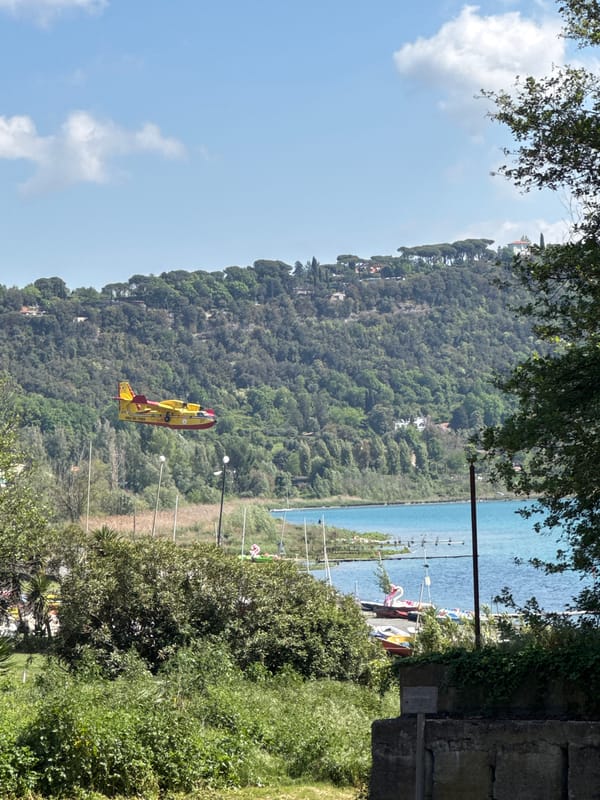 Morning scenes at Lake Albano feature seaplane, wildlife, cyclists