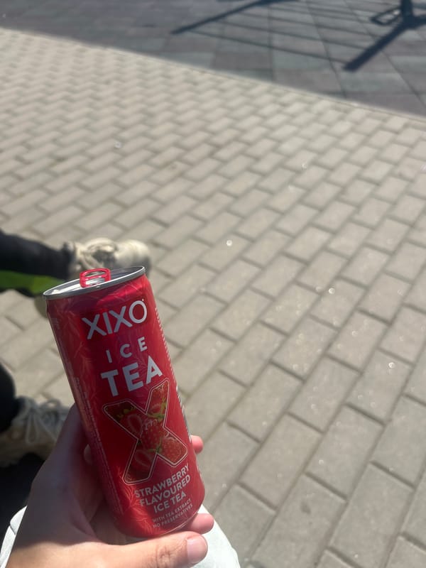 Person enjoys strawberry ice tea on Burgas walkway