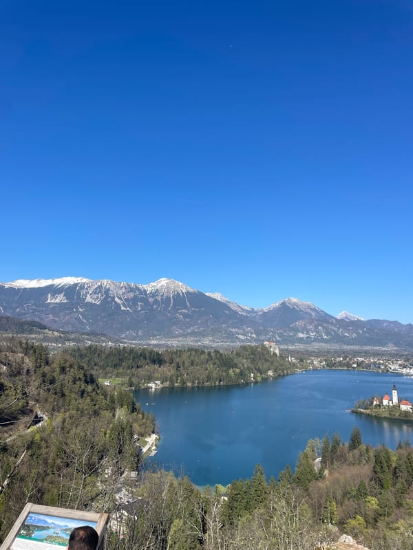 Tourists document scenic Lake Bled views in Slovenia
