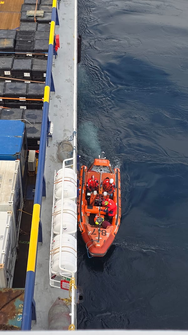 Orange rescue boat with four crew spotted in ocean