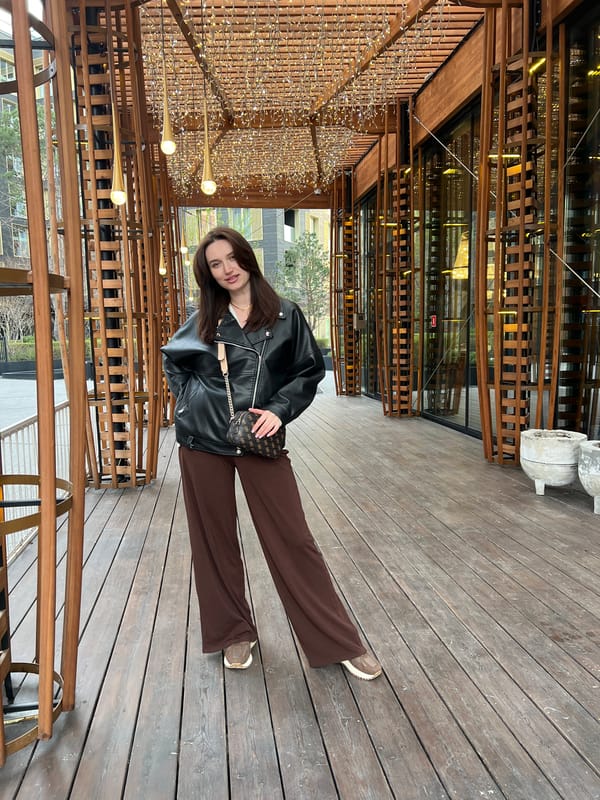 Woman photographed at multiple Tyumen landmarks during afternoon outing