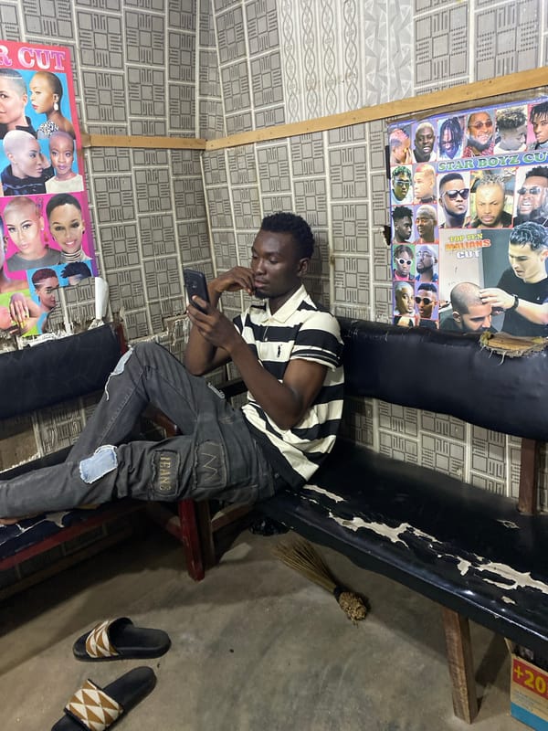 Evening scenes inside a barbershop in Kuson, Nigeria