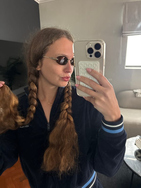 Woman takes bathroom selfies in Cape Town tracksuit