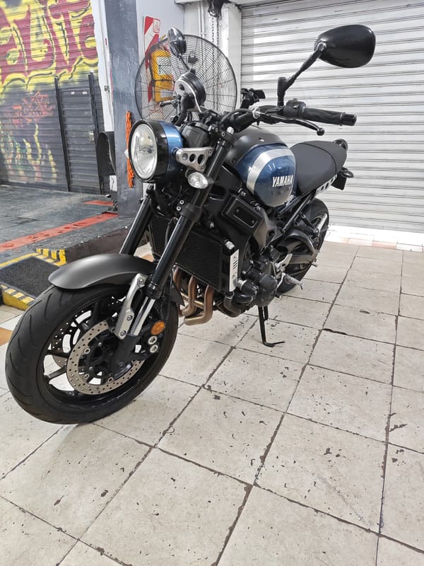 Motorcycles and bicycle parked in Buenos Aires locations