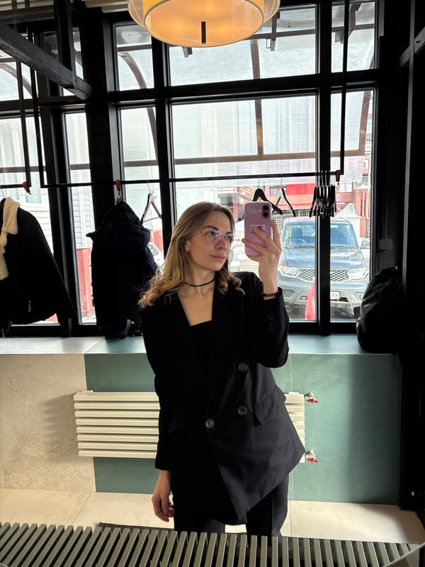 Woman documents cafe visit with photos in Ust-Ilimsk