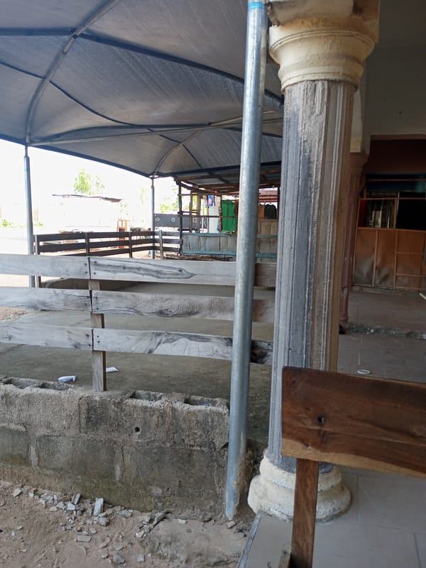 Small roadside shops and dusty streets on a quiet afternoon