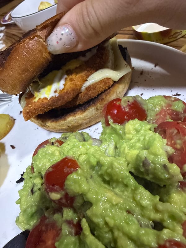 Person prepares sandwich meal with guacamole in Troyan, Bulgaria