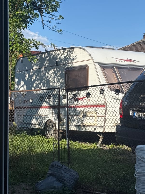 Girl with purple object, caravan spotted in Pernik