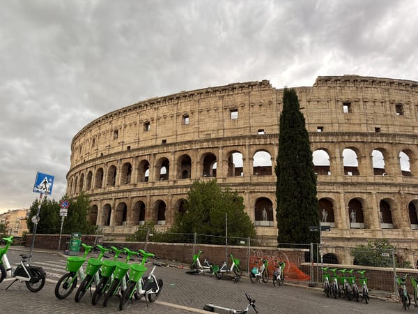 Rome's Colosseum on a cloudy day, seen from all sides