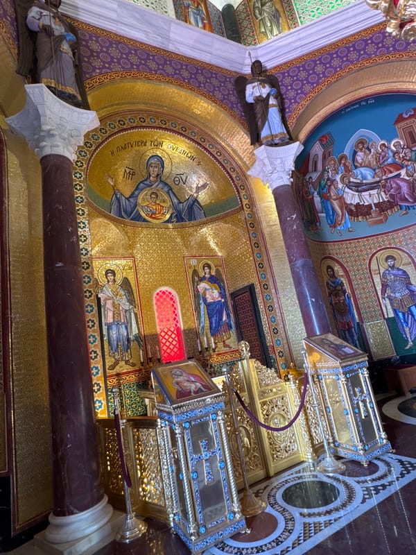 Visitor documents historic Cyprus monasteries and mountain landscape