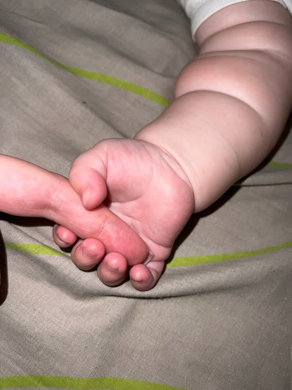Tender adult-infant moments captured in intimate photographs