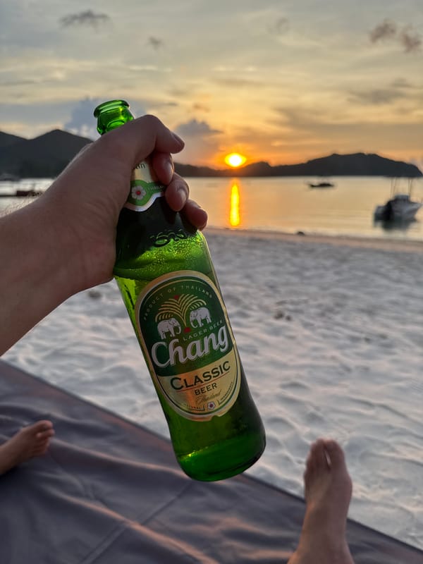 Beach sunset moment captured with Chang beer in Thailand