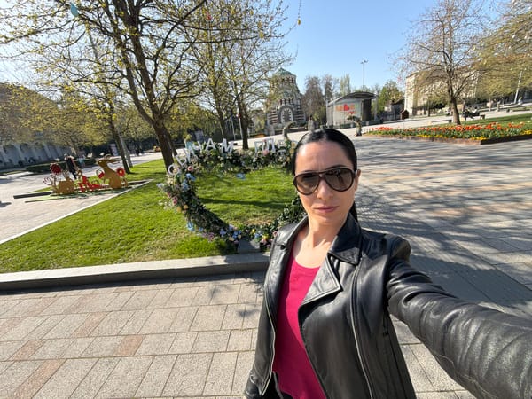 Woman takes morning selfies in Pleven public square