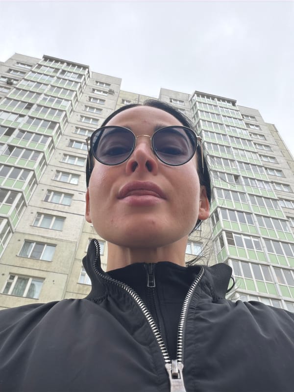 Morning selfie taken outside tall building in Saint Petersburg