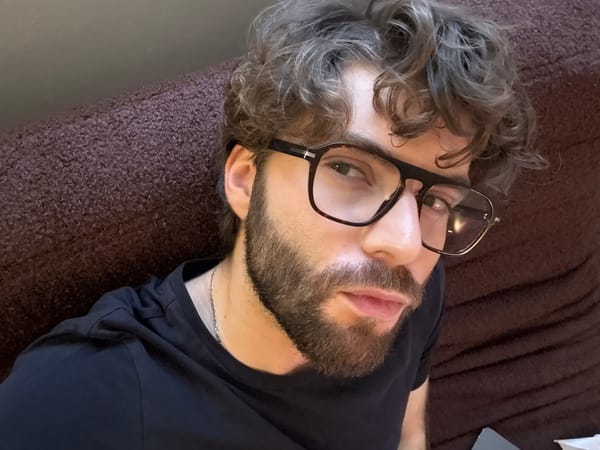 Man drinks green beverage in Montreal apartment setting
