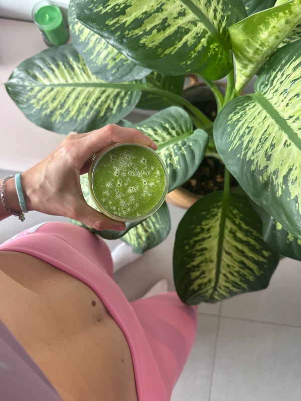 Person drinks green smoothie in Givatayim, Israel