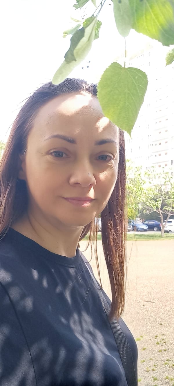 Woman photographed outdoors in sunlight near tree in Krasnodar
