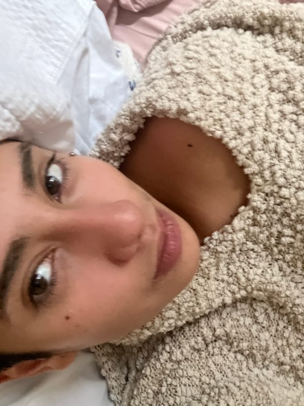 Personal moments captured in Buenos Aires: selfie, cat on bed