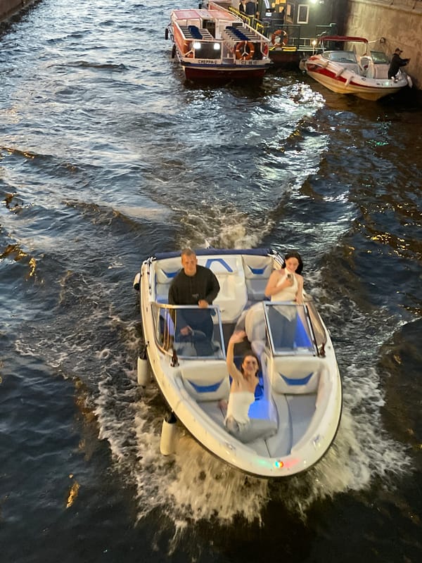 St. Petersburg canals at twilight, plus a cat and toy cars