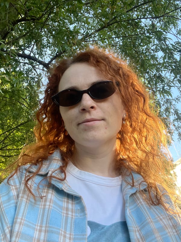 Woman takes selfie near stroller in Chaikovsky park area