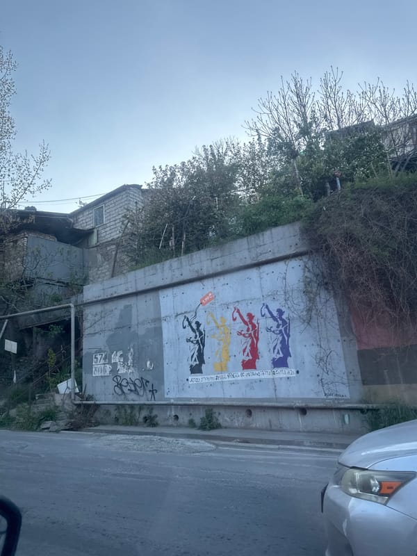 Tbilisi street scenes captured during afternoon traffic and construction