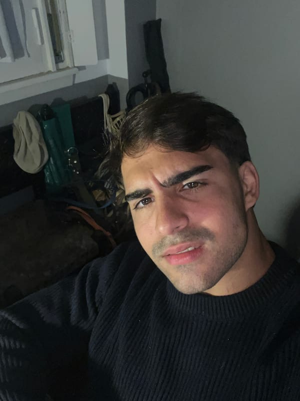 Young man takes selfies indoors in Avellaneda, Argentina