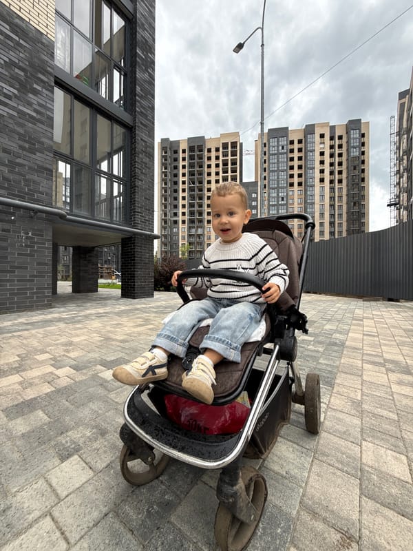 Selfies with a stroller outside Rusanovo apartment buildings
