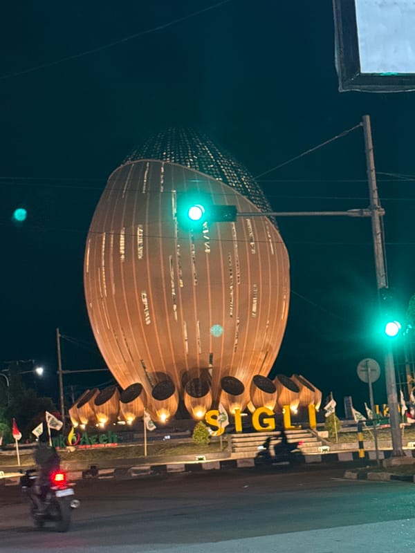 Evening scenes captured in Sigli, Indonesia show monument, local shop