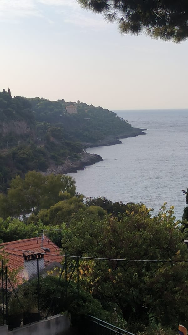 Mediterranean coastal city, rooftops to street-level details