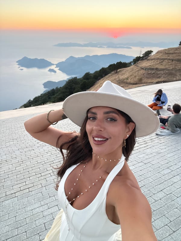 Sunset dining and selfies at a Fethiye overlook restaurant