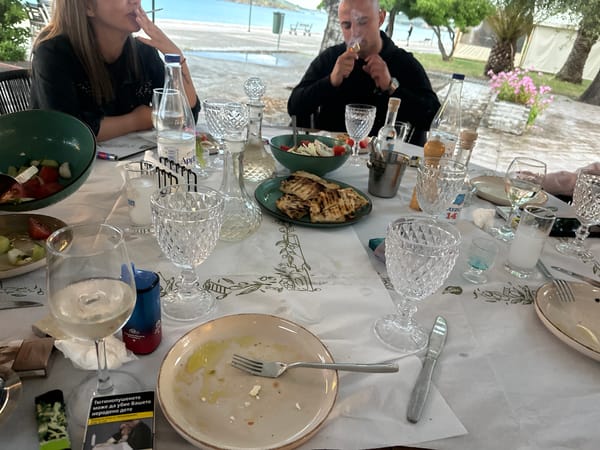 Post-meal table scene captured in Nea Peramos, Greece