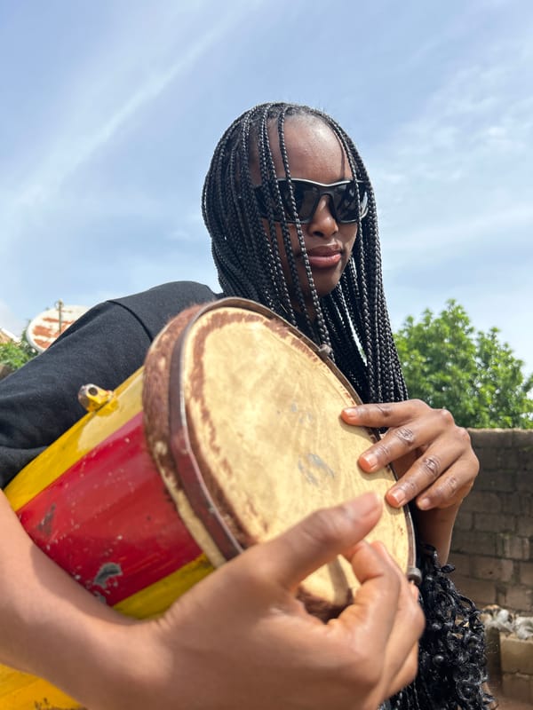 Drum in hand, Jos streets, a quiet Saturday morning