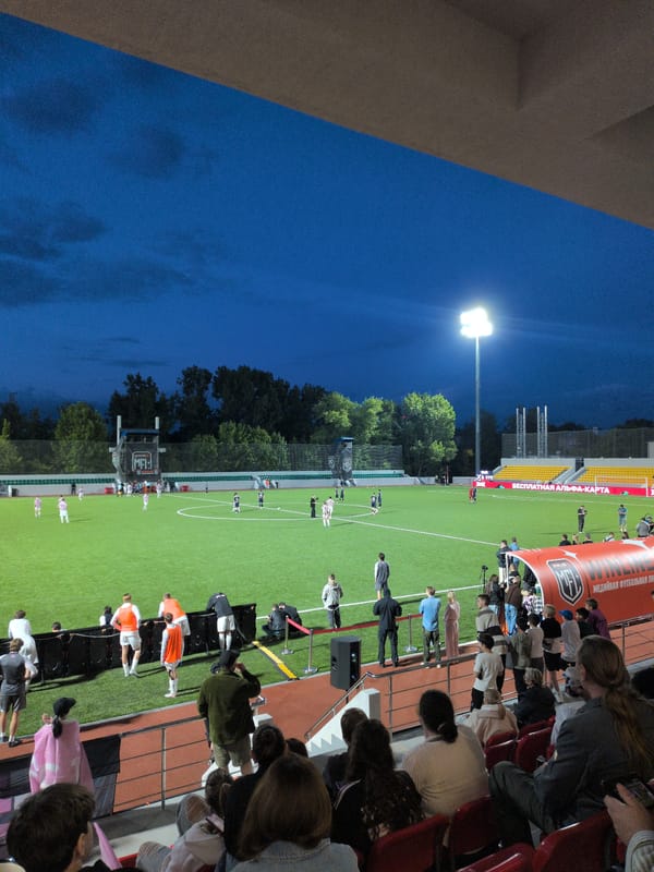 Evening football match under floodlights in Vnukovo, Russia