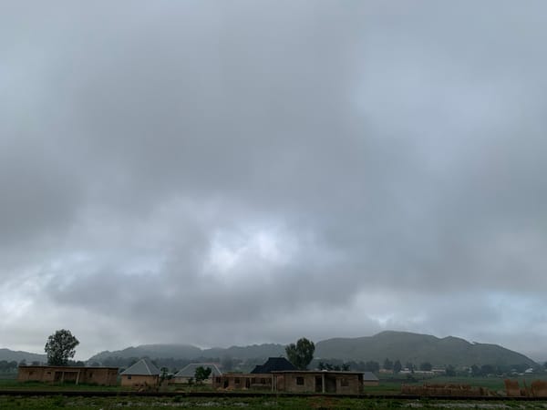 Overcast morning in Kuru Karama, Nigeria, with scattered everyday details