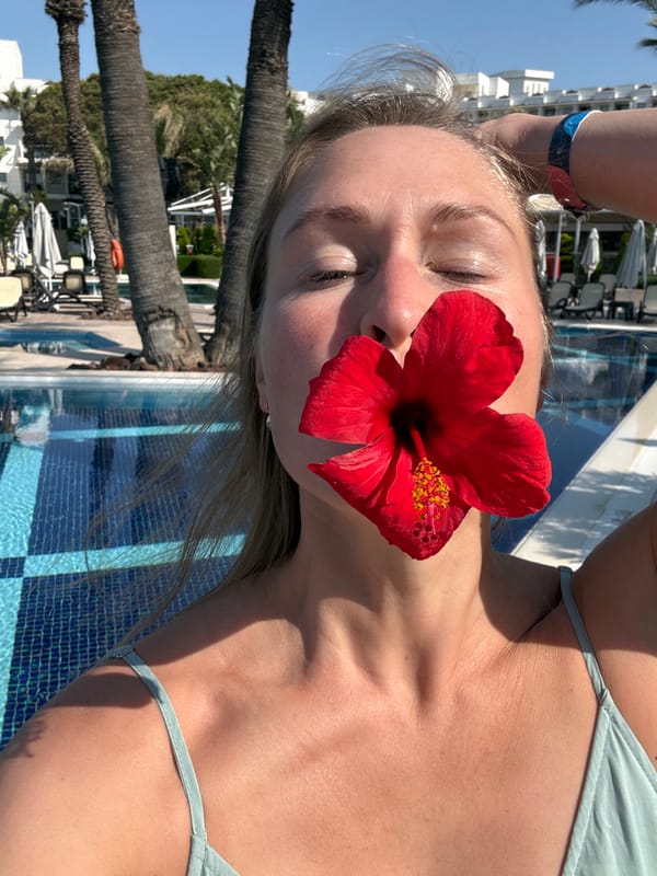 Family documents Turkish resort vacation with hibiscus flower photos