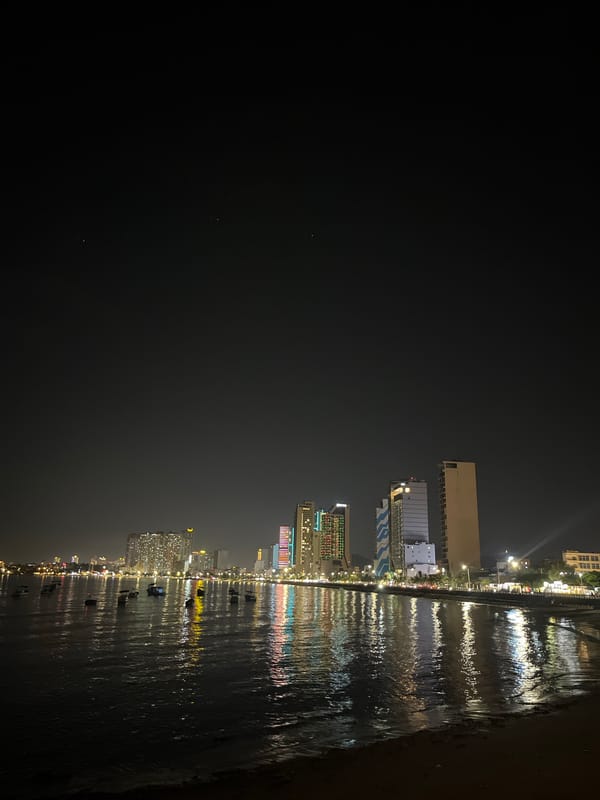 Nha Trang beachfront at night, restaurants and skyline lit up