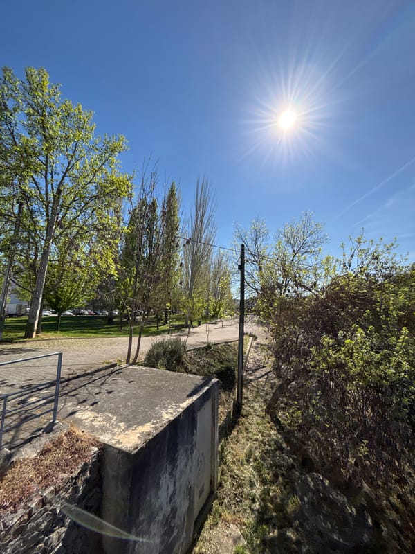 Afternoon stroll documented through sunny Mirandela, Portugal streets and riverfront