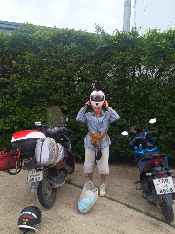 Early morning motorcycle departure preparations in Ban Ao Nang