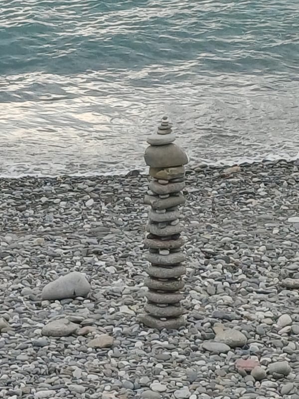 Cloudy summer day on Sochi's Black Sea pebble beach