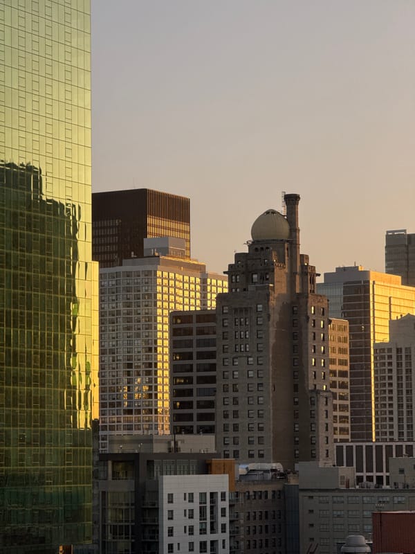 Chicago skyline glowing under a hazy orange sky