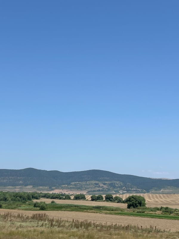 Hay baling underway in the fields outside Poroy, Bulgaria