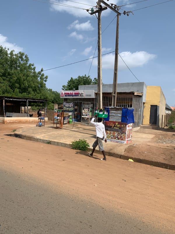 Street vendors serve customers along Jebba Road in Ilorin