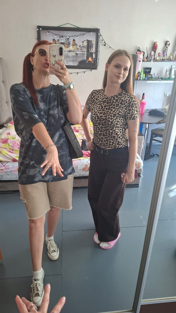 Mirror selfies and a dressed-up Sphynx cat, indoors in Belarus