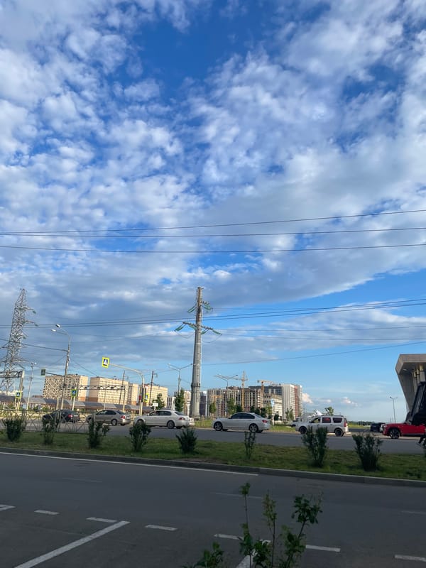 Afternoon street life around a Stavropol commercial district